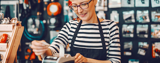 woman looking at a cash register